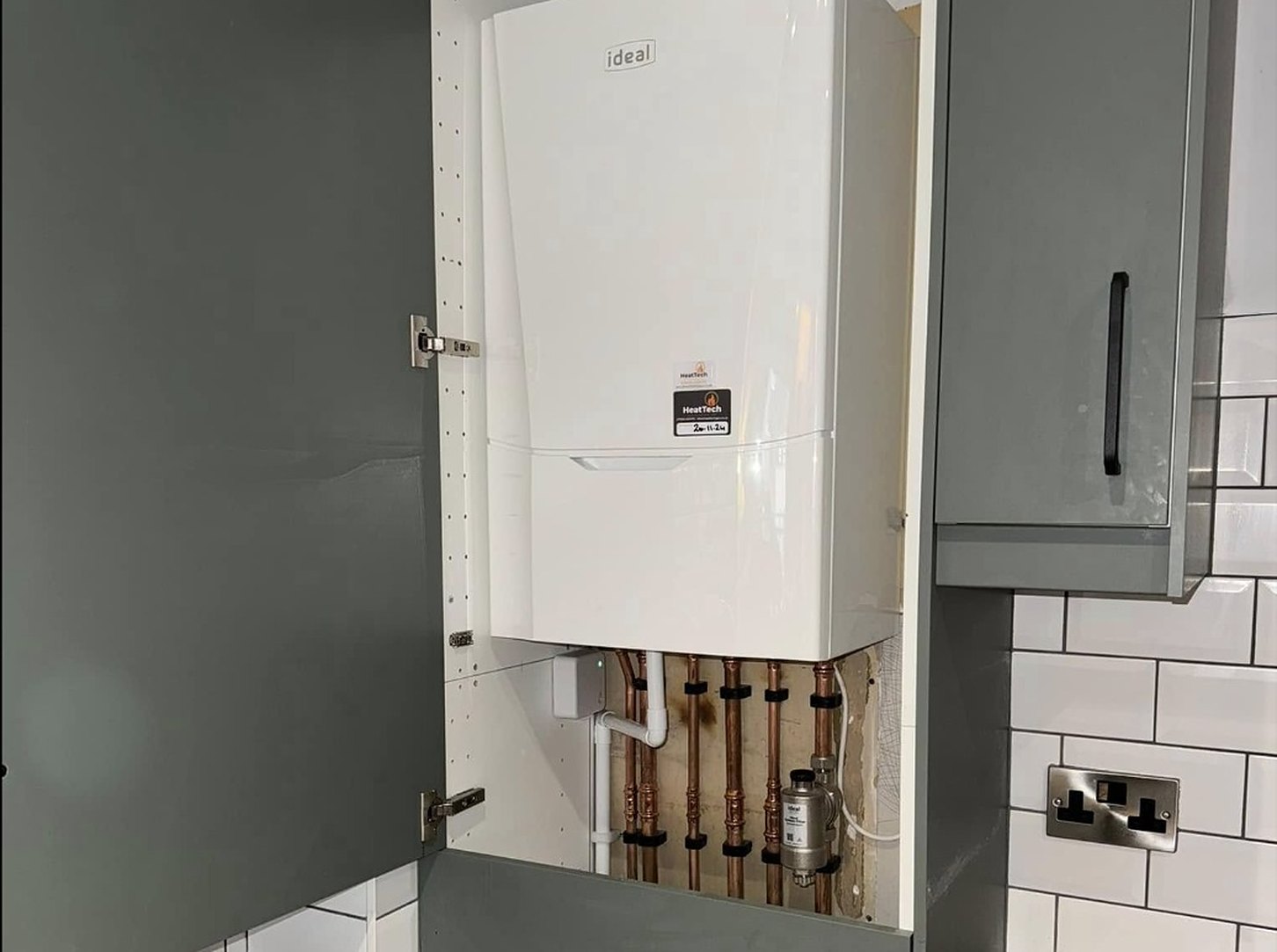 Ideal combi boiler installed in a kitchen cupboard by Heattech Gas Services